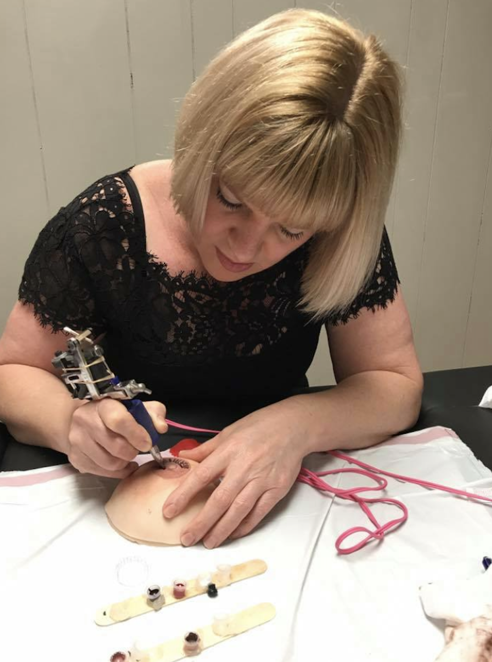Vicky Martin 2017 Arkansas training day student tattooing on one of Vicky's VMM® life-like realistic breast moulds